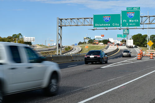 Vehicles travel on Interstate 35E northbound bridge that goes over Dallas Drive.
